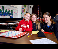 Three young people playing Scrabble thumbnail265786